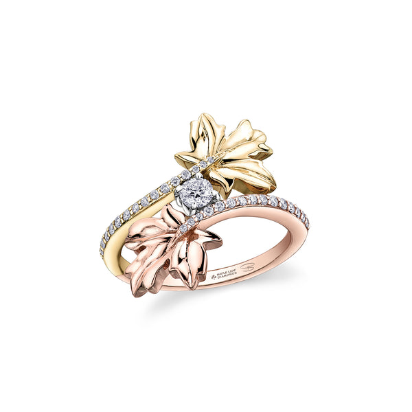 Crafted in 14KT rose, yellow and white Certified Canadian Gold, this ring features two large maple leaves cradling a round brilliant-cut Canadian centre diamond on a diamond-set band.