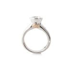 Crafted in 14KT white gold, this ring features a bezel set round-cut diamond with signature trademark on both sides. 