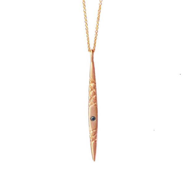 Crafted in 14KT rose gold, this spear-inspired pendant features a round black diamond and quilted details. 