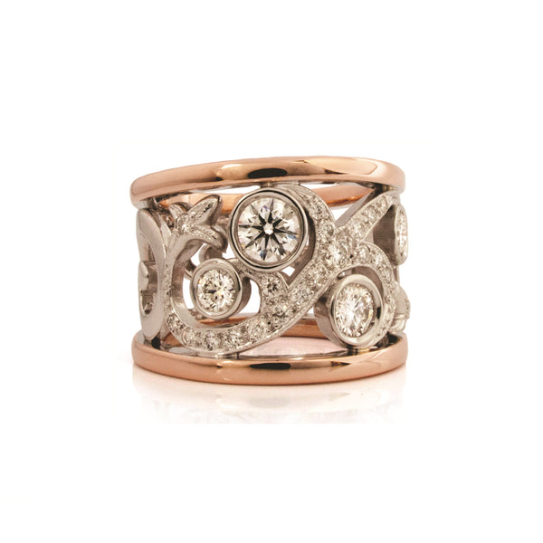 Crafted in 14KT white and rose gold, this ring features a diamond-set rose vine design.