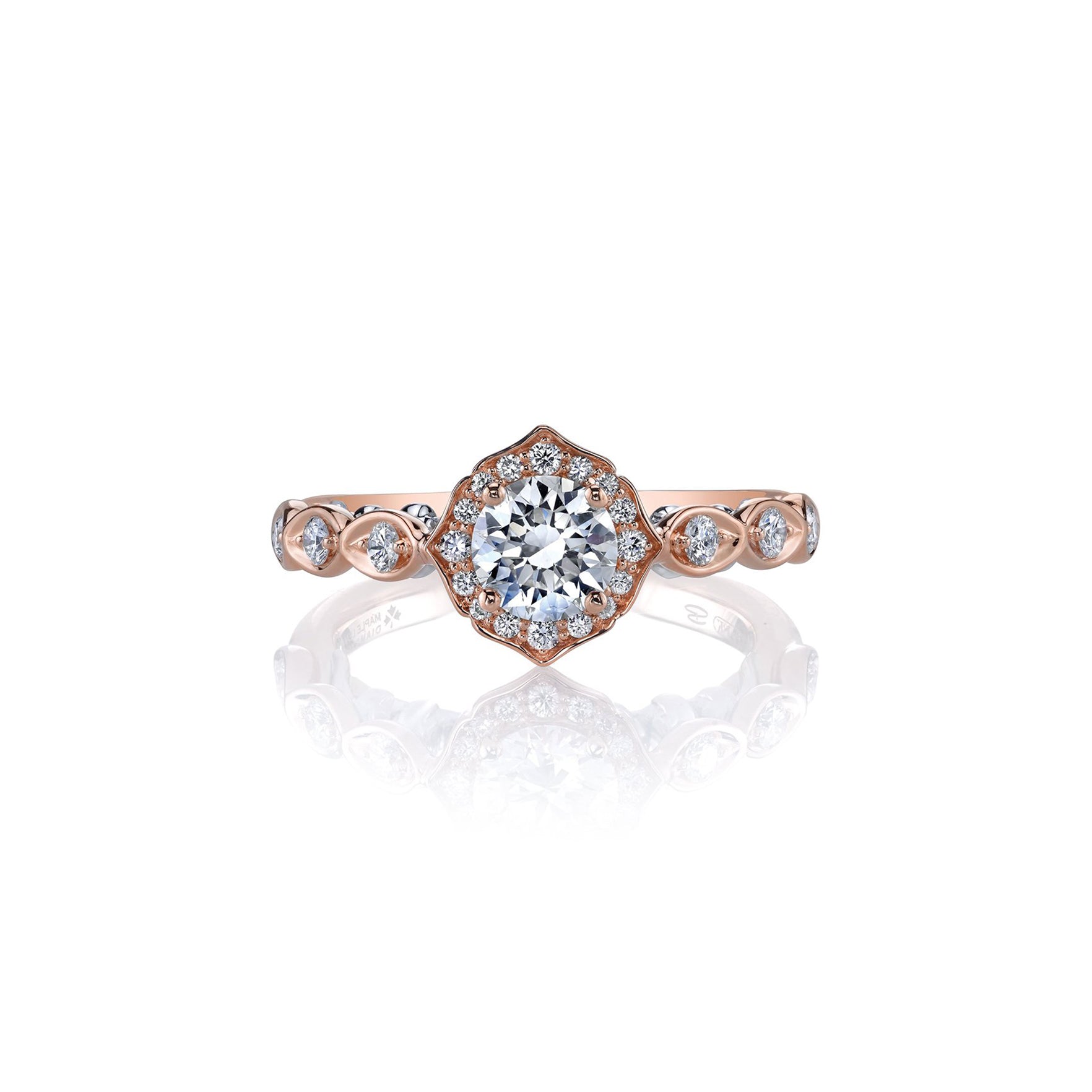 Crafted in 18KT rose and white gold, this lily of the valley flower-inspired ring is set with Canadian diamonds. 