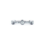 Crafted in 14KT white gold, this ring features six round brilliant-cut diamonds evenly spaced apart on a diamond set band. 