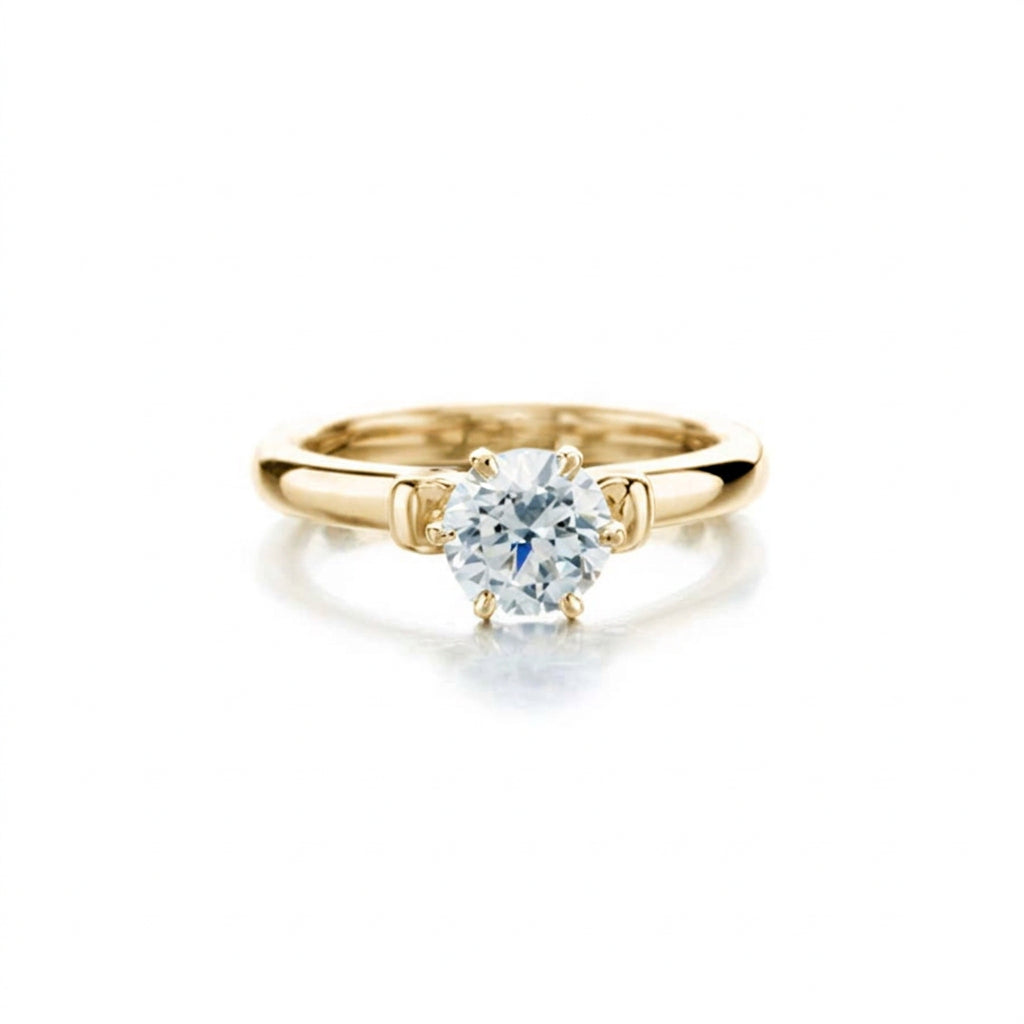 Crafted in 14KT gold, this engagement ring features a round brilliant-cut centre diamond and diamond details. 