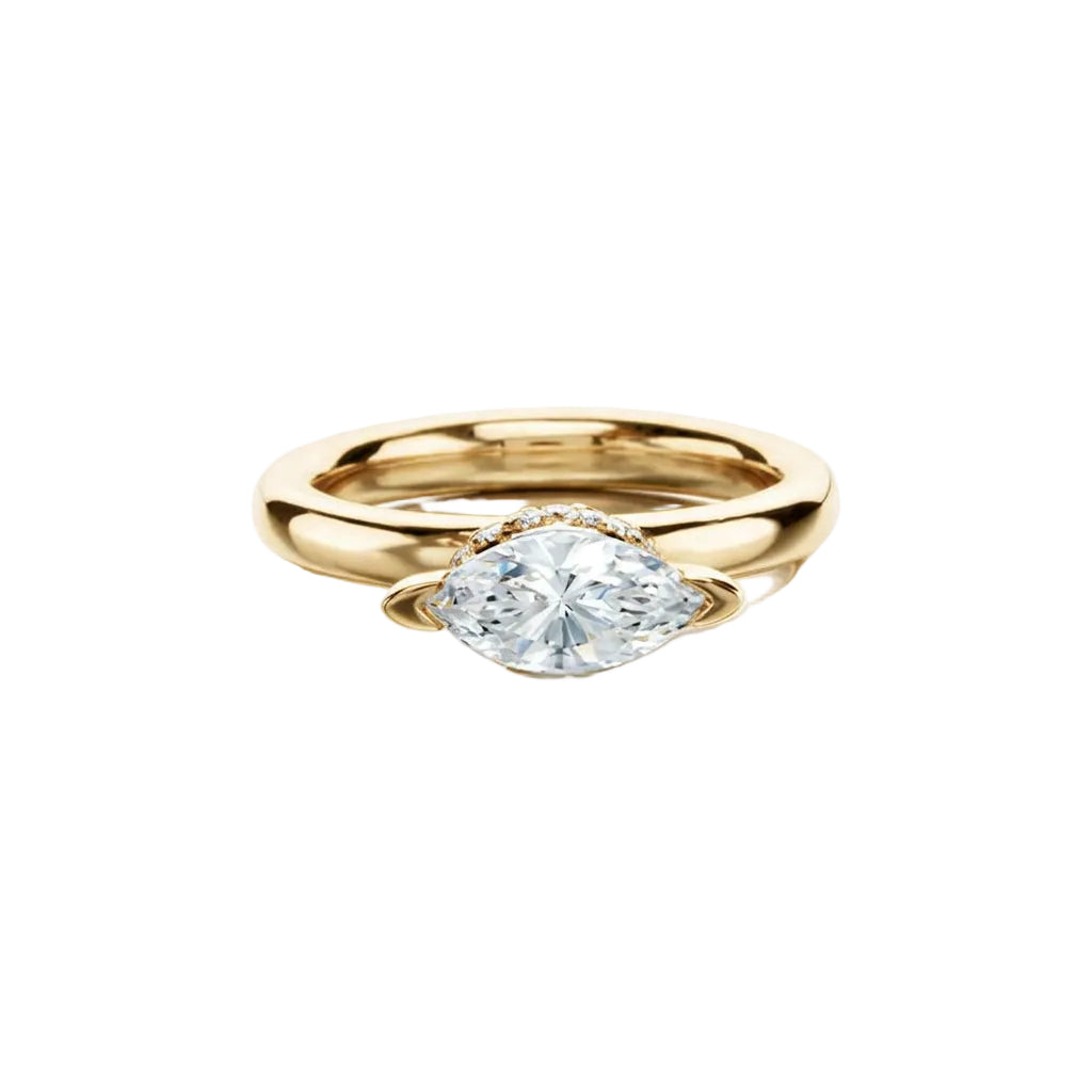 Crafted in 14KT gold, this engagement ring features diamond and blue sapphire details that compliment a marquise-cut centre diamond.