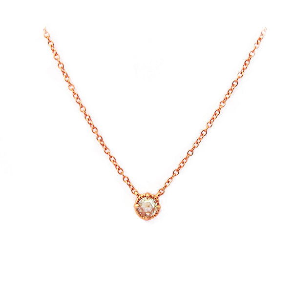 Crafted in 14KT gold, this necklace is set with a white rose-cut diamond. 
