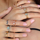 Vintage style rings paired together showing many options of wedding and engagement rings featuring diamonds, sapphire and aquamarine with hand-engraving in yellow white and rose gold.