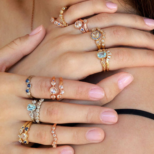 Vintage style rings paired together showing many options of wedding and engagement rings featuring diamonds, sapphire and aquamarine with hand-engraving in yellow white and rose gold.