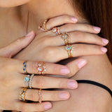 Vintage style rings paired together showing many options of wedding and engagement rings featuring diamonds, sapphire and aquamarine with hand-engraving in yellow white and rose gold.