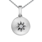 Back side of the locket features a small water lily cut out with a round brilliant-cut Canadian centre diamond.