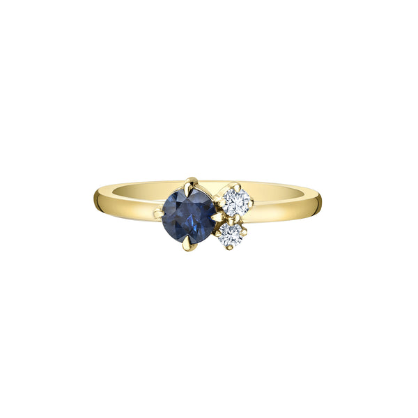 Crafted in yellow 14KT Canadian Certified Gold, this ring features a sapphire and two round brilliant cut Canadian diamonds.
