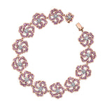 Crafted in 14KT white and rose Certified Canadian Gold, this bracelet features wildflowers set with round brilliant-cut Canadian diamonds, amethyst and pink sapphires.