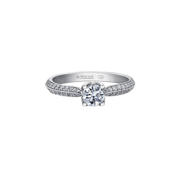 Crafted in 18kt Pure White™, this engagement ring features a round brilliant-cut Canadian diamond cradled by 4-petal water lily flower on a diamond set band. 