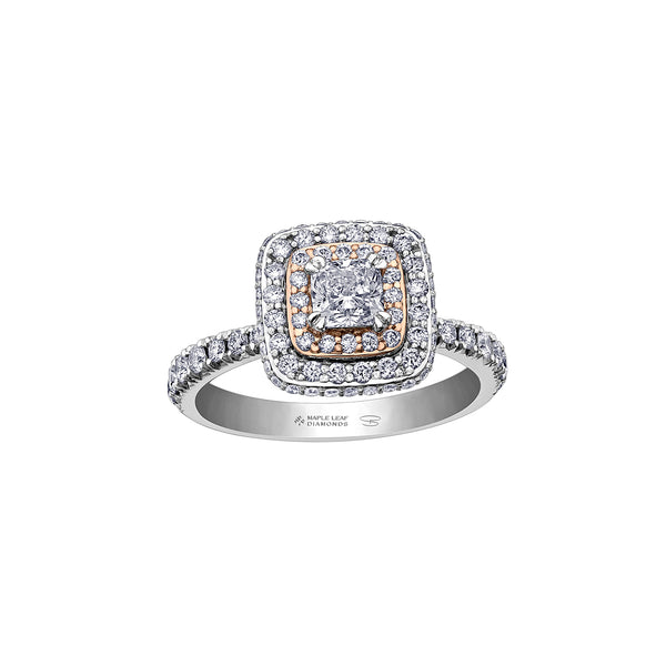 Crafted in 18KT rose and white Certified Canadian Gold, this ring features a diamond set double halo with a cushion-cut Canadian centre diamond. Diamond set band and has hidden maple leaf details.